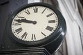 Aged railway station clock with Roman numerals Royalty Free Stock Photo