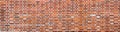 Aged Red Brick Wall texture background. Old stone panoramic background Royalty Free Stock Photo