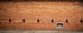 Aged red brick wall with windows background, Chiang Mai old city wall gate, Thailand Royalty Free Stock Photo