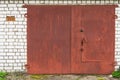 Aged red metal garage gate
