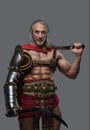 Aged but still mighty muscular gladiator with long grey hair and beard