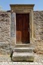 Aged structure with a wooden door and stone steps leading up to the entrance in Bavaria Royalty Free Stock Photo