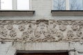 Aged stucco relief on building facade in Kyiv Ukraine