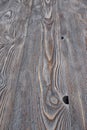 Aged and tinted pine boards with knots and a pronounced structure