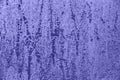 Aged toned in color of the year 2022 violet very peri weathered background with spots, stains or grunge rough backdrop.
