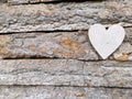 Aged tree bark Christmas gift with heart background. Nature wood background Royalty Free Stock Photo