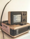 Aged vintage computer terminal with a small monochrome screen displaying technical data, retro technology concept