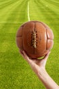 Aged vintage retro football leather ball Royalty Free Stock Photo