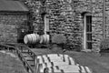 Aged whiskey, scotch, bourbon barrels in Kentucky ready for transportation in black and white Royalty Free Stock Photo
