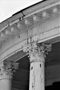 Aged white Corinthian column tops, black and white