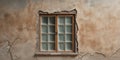 Aged window sits on a weathered and cracked plaster wall Royalty Free Stock Photo