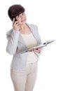 Aged woman posing like an office worker, administrator, secretary. Portrait against of white background Royalty Free Stock Photo