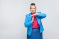 Aged woman showing time out sign