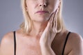 Aged woman with toothache, teeth pain closeup