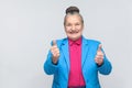 Aged woman toothy smiling and showing like sign Royalty Free Stock Photo