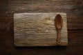 Aged wood cutting board copyspace and spoon