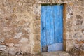 Aged wooden blue door and stone wall in Mallorca island. Spain Royalty Free Stock Photo