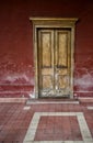 Aged wooden door of a historic house in the city of Copiapo. Chile