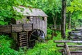 Aged wooden mill, in a lush green wooded area in Great Smokey Mountain National Park in Tennessee Royalty Free Stock Photo