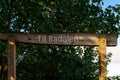 there is a wooden sign that reads ti hadalah