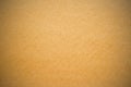 Aged yellow brown paper. Textural background with vignette. Royalty Free Stock Photo