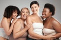 Ageing like fine wine. a diverse group of women standing and hugging each other in the studio. Royalty Free Stock Photo