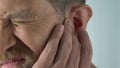 Ageing male has ear ache after catching draft, bacterial infection, otitis pain