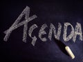 agenda word displayed on chalkboard concept with dark background