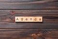 AGENDA word written on wood block. AGENDA text on cement table for your desing, concept Royalty Free Stock Photo