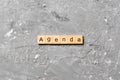 AGENDA word written on wood block. AGENDA text on cement table for your desing, concept Royalty Free Stock Photo