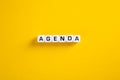 Agenda word on yellow background