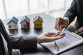 Agent giving client new house key in office The happy man has received the keys Royalty Free Stock Photo