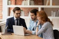 Agent makes offer for couple showing services presentation on laptop