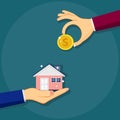 Agent of real estate holding in hand house. customer gives gold coin. Buying house