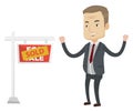 Agent standing near sold real estate sign. Royalty Free Stock Photo