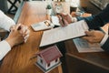 Agents are using pens pointing to contracts and are being explained to customers at the office Royalty Free Stock Photo