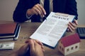 Agents are using pens pointing to insurance contracts and are being explained to customers at the office Royalty Free Stock Photo