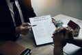 Agents are using pens pointing to insurance contracts and are being explained to customers at the office Royalty Free Stock Photo