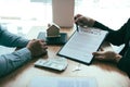 Agents are using pens pointing to insurance contracts and are being explained to customers at the office Royalty Free Stock Photo