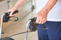 Ages senior man using walker indoor, detail on man's hands Royalty Free Stock Photo