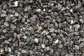 Aggregate of dark gray and coarse stones crushed at a stone pit - gravel pattern Royalty Free Stock Photo