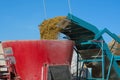 The aggregate for the extraction of silage from the pit loads small-cut food