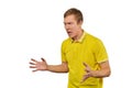 Aggressive angry man in yellow T-shirt ready to fight with fists isolated on white background Royalty Free Stock Photo