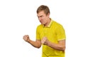 Aggressive angry man in yellow T-shirt ready to fight with fists isolated on white background Royalty Free Stock Photo