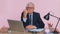 Aggressive angry senior business man trying to fight at camera, shaking fist, boxing, punishment Royalty Free Stock Photo