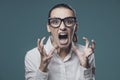 Aggressive angry woman shouting at camera