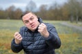 Aggressive angry young man threatening the camera