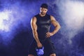 Aggressive bearded muscular bodybuilder doing Exercise for the biceps with kettlebell. Studio shot Royalty Free Stock Photo