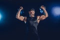 Aggressive bearded muscular bodybuilder doing Exercise for the shoulder muscles, deltoid with kettlebell. Royalty Free Stock Photo