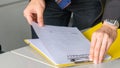 Aggressive boss businessman holding paper file work and complain staff and colleague in meeting conference room